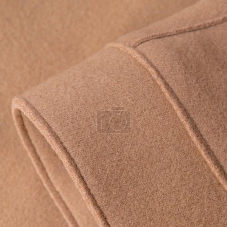 Photo for Sleeve of beige woolen coat close up background - Royalty Free Image