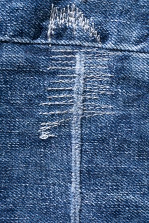 Photo for Details of blue jeans with decorative seams background close up - Royalty Free Image