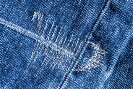 Photo for Details of blue jeans with decorative seams background close up - Royalty Free Image