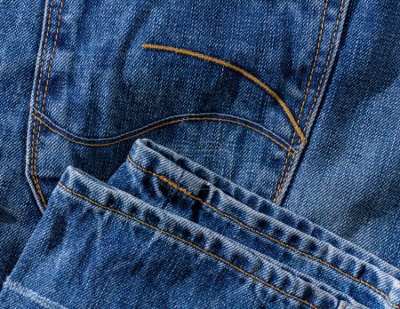 Photo for Details of blue jeans - back pocket and bottom background close up - Royalty Free Image