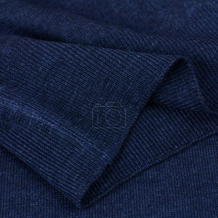 Banda elástica de punto sobre fondo jersey de lana azul marino de cerca