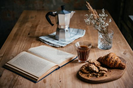 Photo for Enjoying comfortable reading and coffee at home. - Royalty Free Image