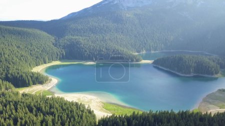 Photo for Biogradskoe lake (Aerial shot) is a glacial lake located in the inter-mountain valley of Bjelasica. Kolasin, Biogradska Gora national park. Montenegro (Europe) - Royalty Free Image