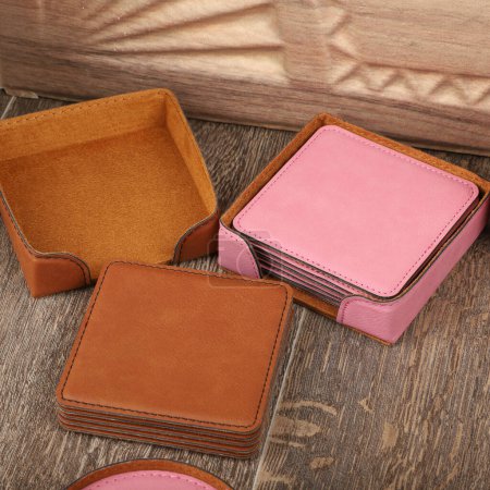 Photo for Leather table mats in different colors. Concept shot, top view. Custom background view of leather table coaster. Stitched and leather table coaster. - Royalty Free Image