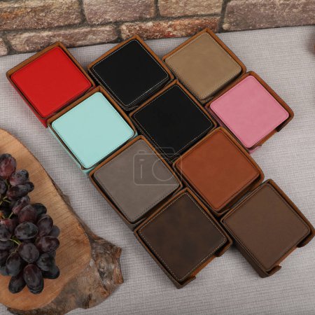 Photo for Leather table mats in different colors. Concept shot, top view. Custom background view of leather table coaster. Stitched and leather table coaster. - Royalty Free Image