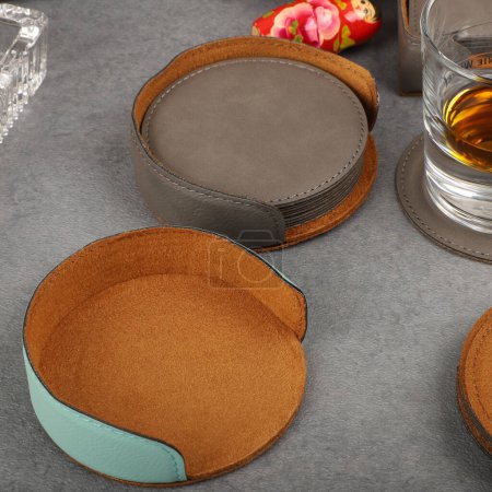 Photo for Leather table mats in different colors. Concept shot, top view. Custom background view of leather table coaster. Stitched and leather table coaster - Royalty Free Image