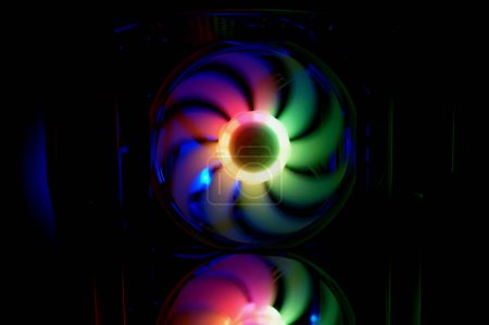 Colorful bright rainbow led rgb pc fan air case cooler. Computer chassis. Gaming modding, technology concept and IT background.