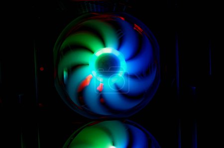 Foto de Colorful bright rainbow led rgb pc fan air case cooler. Computer chassis. Gaming modding, technology concept and IT background. - Imagen libre de derechos
