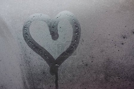 Photo for Painted heart on the foggy window. I love you on Valentine's Day. - Royalty Free Image