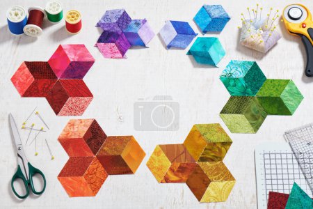 Photo for Preparing of bright diamond pieces of fabrics for sewing quilt, sewing and quilting accessories - Royalty Free Image