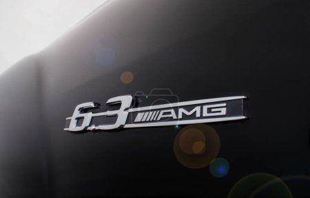 Téléchargez les photos : Almaty, Kazakhstan - November 20, 2021: 6.3 AMG emblem on the fender of a black Mercedes-Benz car. Lens flare. - en image libre de droit