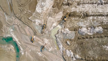 Photo for Excavators on the shallow lake bed. Cleaning works. View from a drone - Royalty Free Image