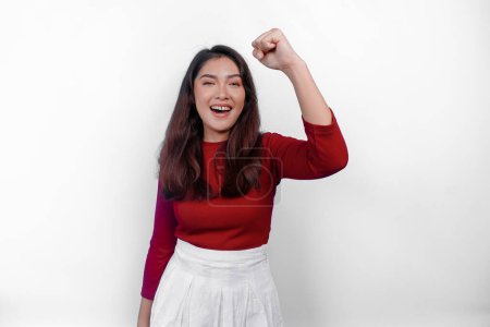 Photo for A young Asian woman with a happy successful expression wearing red top isolated by white background - Royalty Free Image