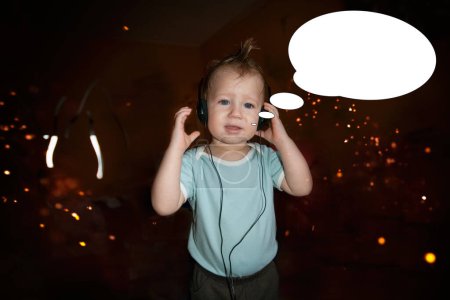 Photo for Little kid hairstyle punk style with headphones listening to music with bubble idea. - Royalty Free Image