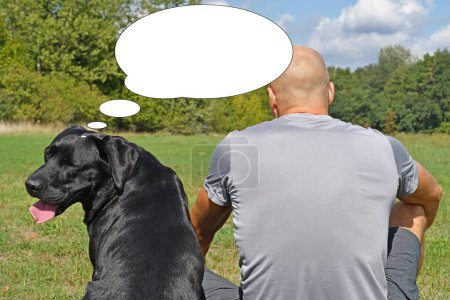 Funny picture with bubble idea black dog with boy in the park at sunny day.