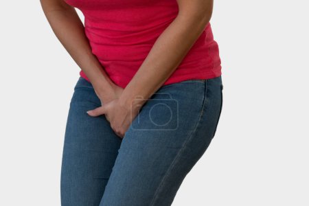 Woman with Hands Holding her Crotch in White Background