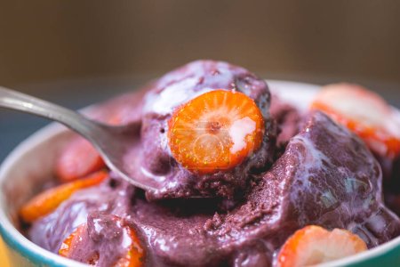 Photo for Acai with strawberry and condensed milk in a bowl. Brazilian food, dessert. - Royalty Free Image