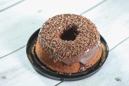Photo for Chocolate cake with chocolate frosting and decorated with chocolate sprinkles - Royalty Free Image