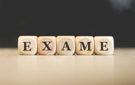 Photo for The word EXAM in Brazilian Portuguese written on wooden cubes. Black background. - Royalty Free Image