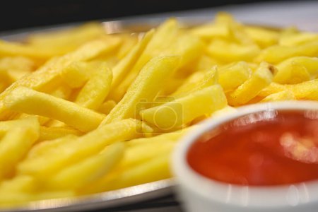 Photo for Tasty french fries potatoes with ketchup, close-up view - Royalty Free Image