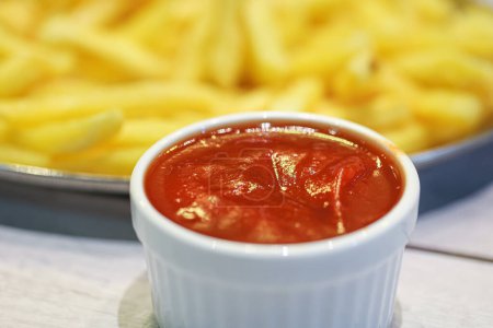 Photo for Tasty french fries potatoes with ketchup, close-up view - Royalty Free Image