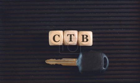 Photo for The acronym CTB written on wooden cubes and key on black background. - Royalty Free Image