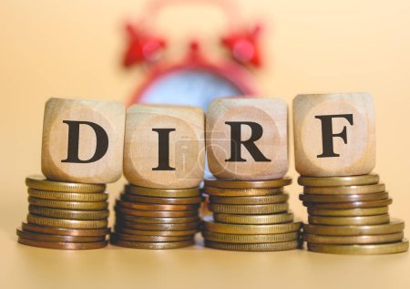 Photo for Acronym DIRF written on wooden cubes and piles of coins. Studio photo. - Royalty Free Image