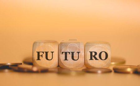 Photo for Word FUTURE in Brazilian Portuguese written on wooden cubes and piles of coins. Studio photo. - Royalty Free Image