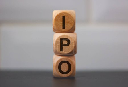 Photo for The acronym IPO for Initial Public Offering written on wooden cubes on grey background - Royalty Free Image