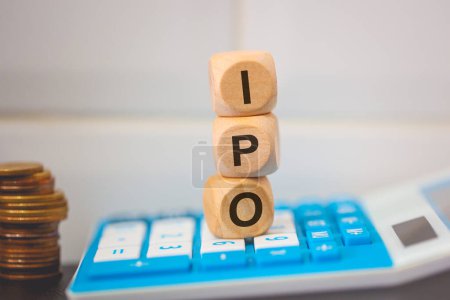 Photo for The acronym IPO written on wooden cubes. A calculator in the composition. - Royalty Free Image