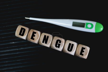Photo for The word Dengue ( Dengue fever ) written on wooden dice. Brazilian Portuguese. Public health. - Royalty Free Image