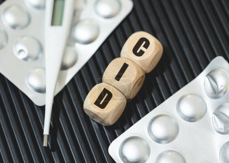 The abbreviation ICD for International Classification of Diseases written on wooden dice in the Brazilian Portuguese language. Health, Medicine, Sick, Patient
