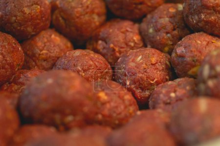 Photo for Close up view of raw meatballs ready for cooking - Royalty Free Image