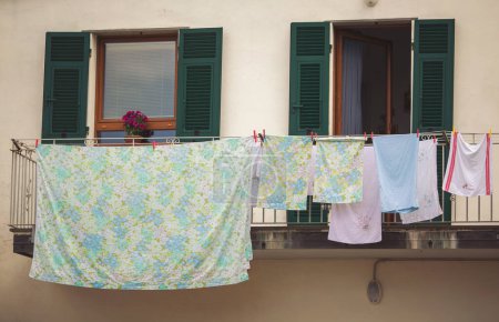 Clothes on the rope between windows, European town, Italy. The linen dries on a rope in the street after washing. Typical situation for Italy. 