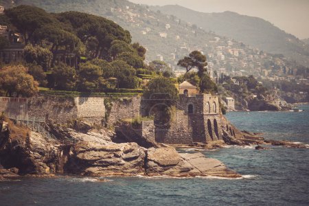 Landscape of ligurian coastline as seen from Anita Graibaldi promenade at Nervi, Liguria, Italy. Seascape with the Mediterranean rocky coastline and promenade at Genoa. 