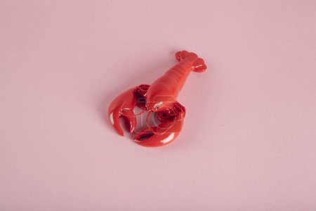 Photo for A red lobster on a pink background. Minimal color still life photography - Royalty Free Image