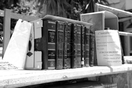 Photo for Jerusalem, Israel - May 5, 2018 Jewish sacred books Torah on bookshelf library for prayer at synagogue. Books Torah from wooden bookcase in Hebrew library. Retro book Rack Torah off islamic library - Royalty Free Image