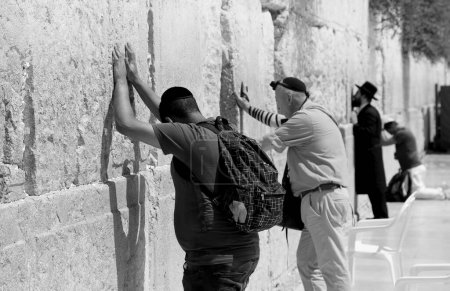 Photo for Israel, Jerusalem - 4 July 2018 Jewish people read prayer near western wailing wall. Hebrew nation worships western wailing wall of after destruction. Western wailing wall is an part in life of Jew. - Royalty Free Image
