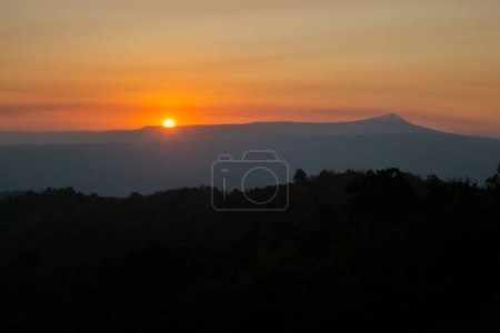 Photo for The morning of sunshine behind the Khao Yai national park mountain  in the  winter of Thailand. Asia sunrise view - Royalty Free Image