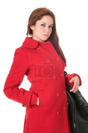Foto de Atractiva mujer de abrigo rojo con bolsa o maleta sobre fondo blanco - Imagen libre de derechos