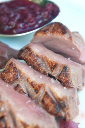 Photo for Delicious grilled duck fillets with its garnish - Royalty Free Image