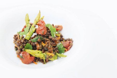 Photo for Delicious dish of lentils with tomatoes and asparagus - Royalty Free Image