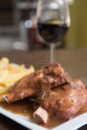 Photo for Delicious beef knuckle with a glass of wine - Royalty Free Image