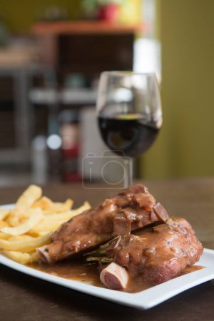 Photo for Delicious beef knuckle with a glass of wine - Royalty Free Image
