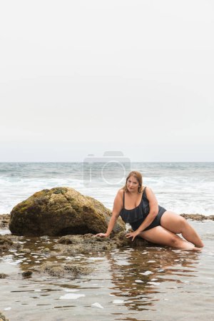 Photo for Real woman with real body representative of diversity in a coastal area under the sun - Royalty Free Image