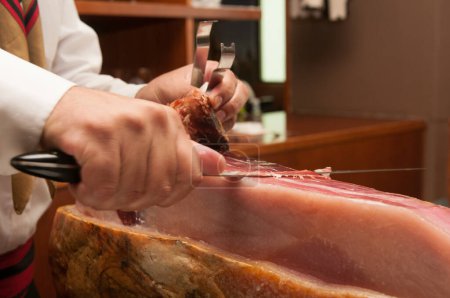 Photo for Cutting Jamon Serrano - traditional spanish ham - Royalty Free Image