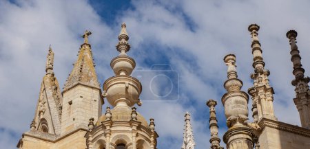 Photo for Leon Cathedral stone pinnacles, Spain. Cloudy blue sky as background - Royalty Free Image