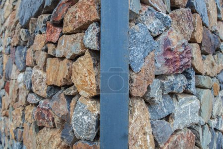Photo for Natural colorful rust quarzite wall. Irregular shape stones - Royalty Free Image