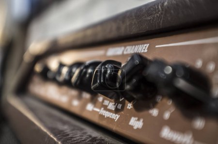 Photo for Electric guitar amplifier device leather-covered. Closeup - Royalty Free Image