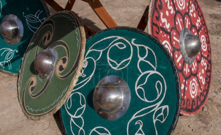 Photo for Celtiberian shield resting on the ground, caetra replicas. Historical reenactment - Royalty Free Image